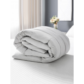Couette en duvet tempérée sur lit